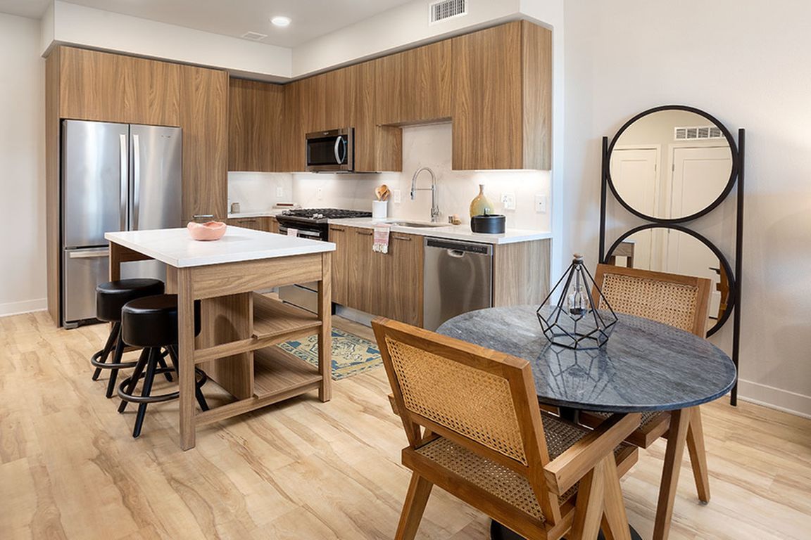 Gourmet kitchens with chefs-island with storage, stainless steel appliances and gas cooking