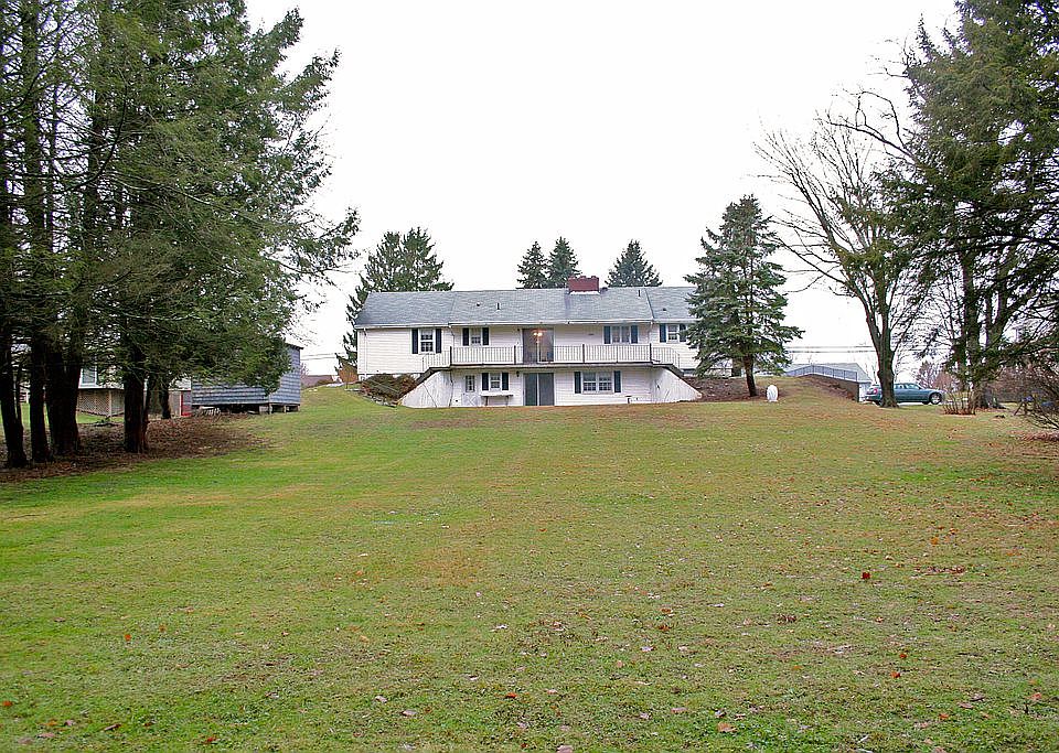 Large backyard abuts woods