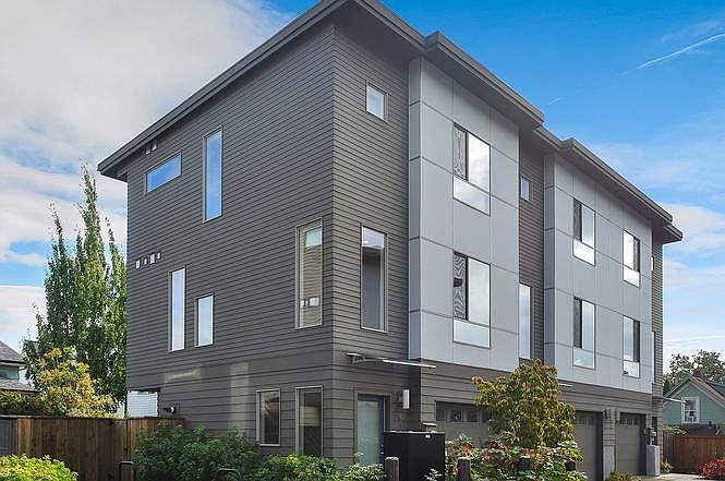 Corner unit with tons of windows letting in natural light. Custom blinds on every window throughout the home.
