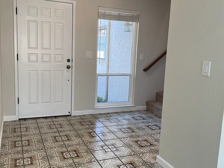 Front entryway with gorgeous mosaic tile.