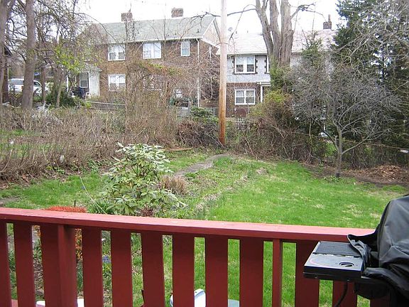 Backyard has wooden fence not pictured here
