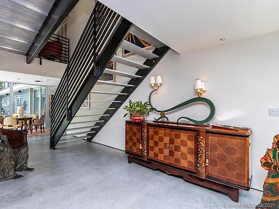 More view of living with 20 ft. ceiling