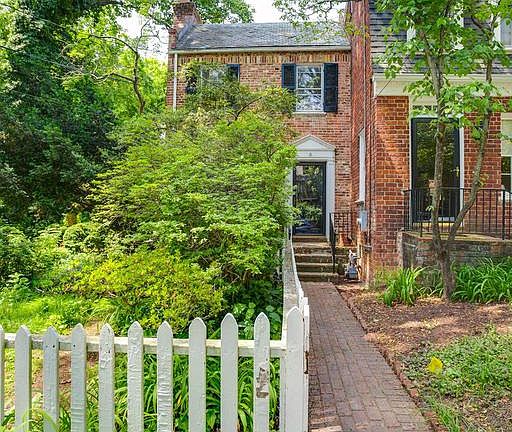 Rarely available end unit with large yard.