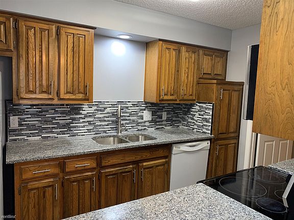 Kitchen with updated countertops and backsplash
