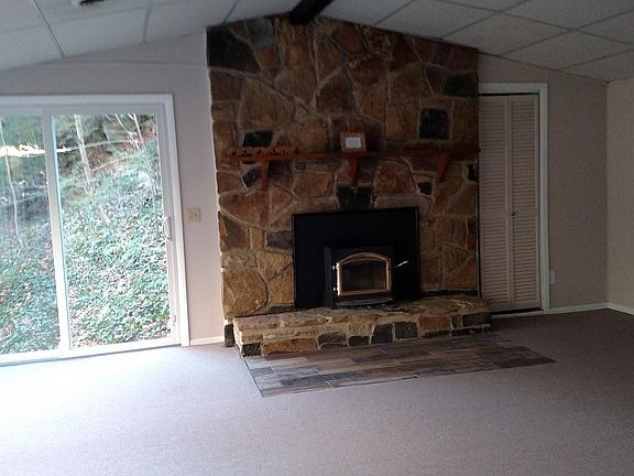 Living Room:Riverstone Fireplace, Woodburning Insert, New Carpet & TIle