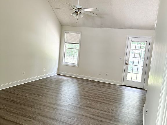 Living room, door to backyard. POV front door entrance