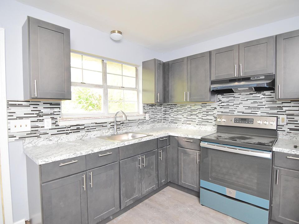 kitchen with gorgeous black and white tiled backsplash