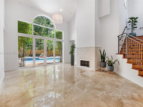 Formal Living Room Overlooks Swimming Pool And Koi Pond