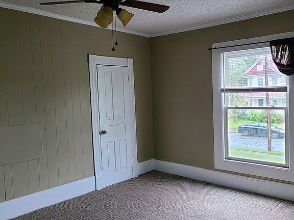 Bedroom one with ceiling fan