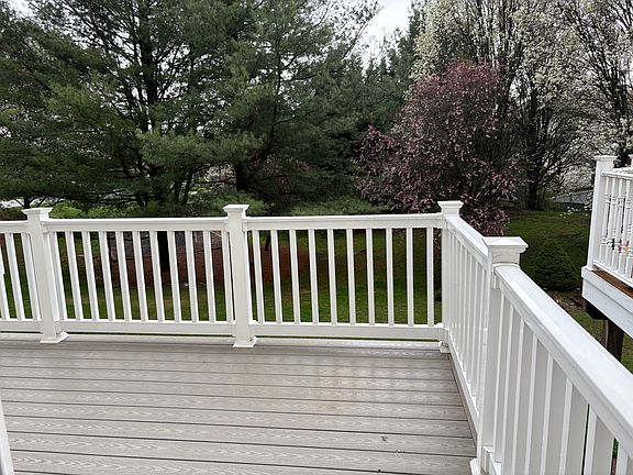 New trex deck and vinyl railings installed 2 years ago. Deck backs to community playground.