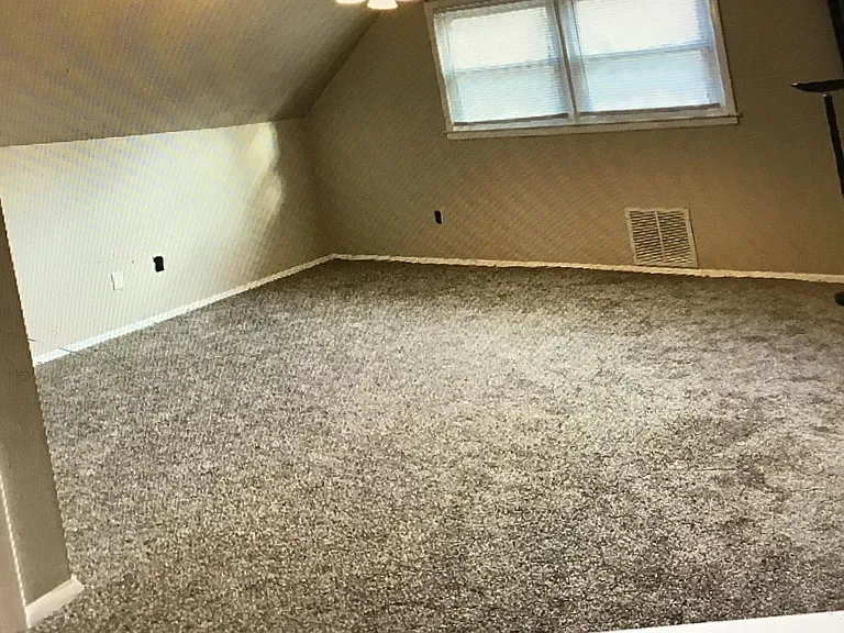 Master bedroom with walk in closet and it has a second closet