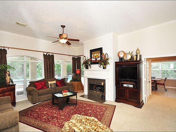 Come relax in the family room, while you enjoy the views to the pool and backyard. Complete with a w