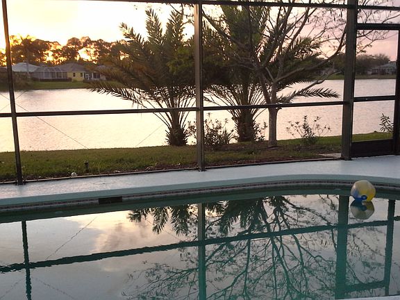 Pool and sunset over lake