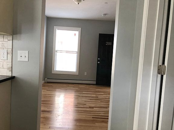Large, bright living area, taken from kitchen