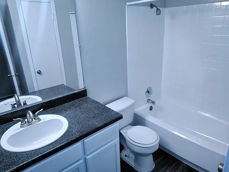Our apartments offer spacious and modern looking bathrooms, with a linen closet available. __