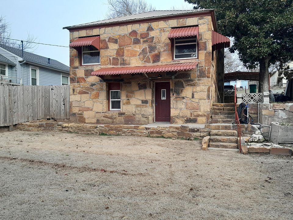 This is a duplex. The lower floor is the advertised unit for rent with one covered parking space.