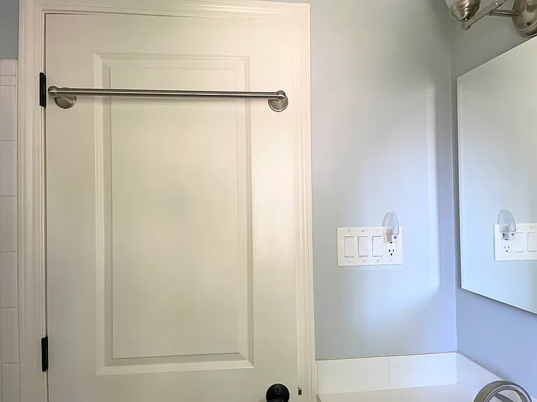 Bathroom door with extra towel hanging