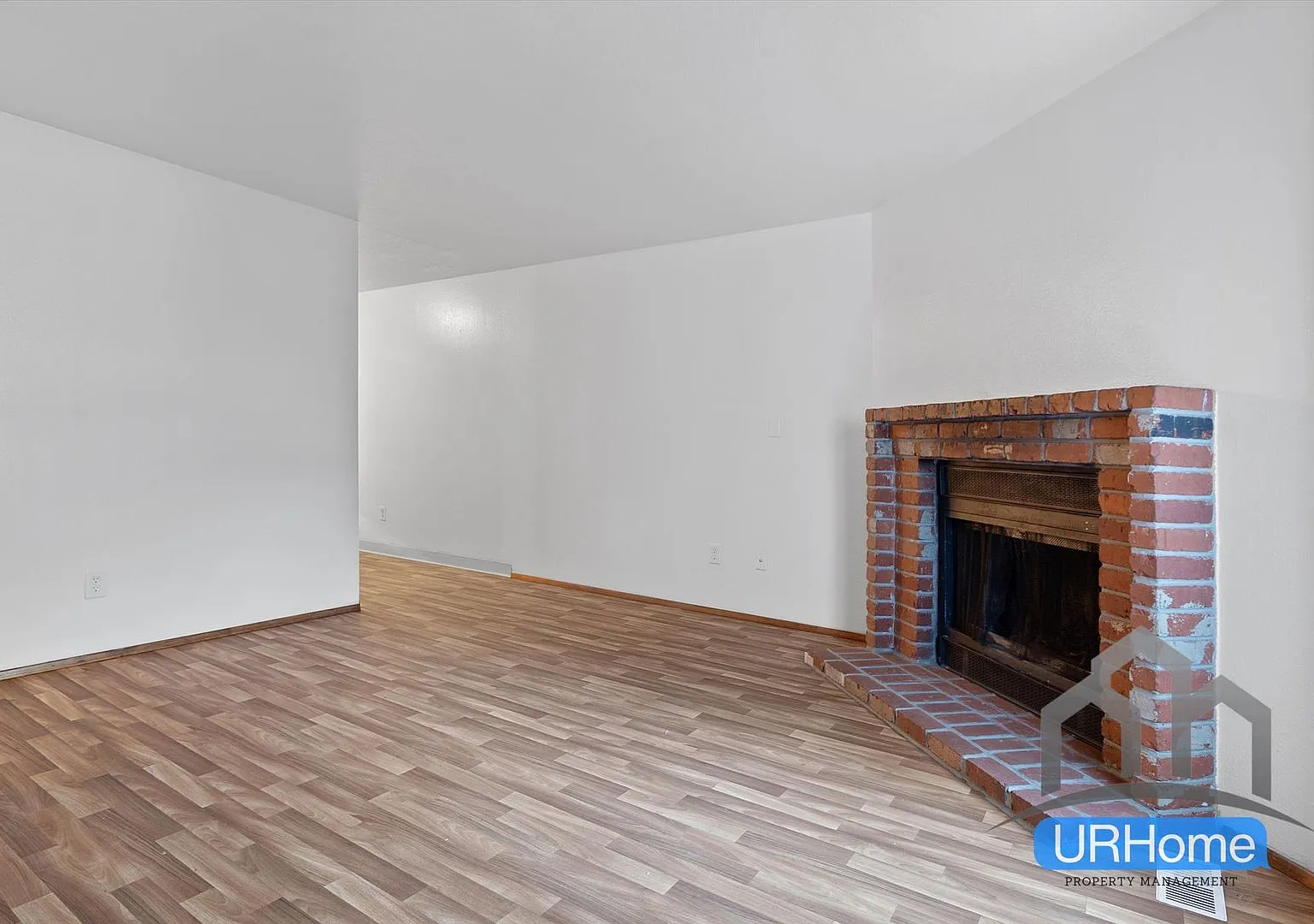 Inviting 2-Bed Retreat | Fireplace, Garage & In-Unit Laundry — Photo 3