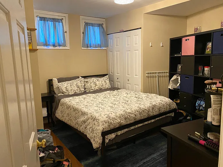 Bedroom 1 with bed under windows