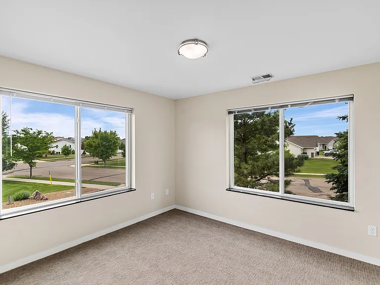 Step into a bright, inviting space at Overlook Ridge featuring large windows that fill the room with natural light. Imagine making this comfortable area your own. Schedule a tour today to see all that this community has to offer!
