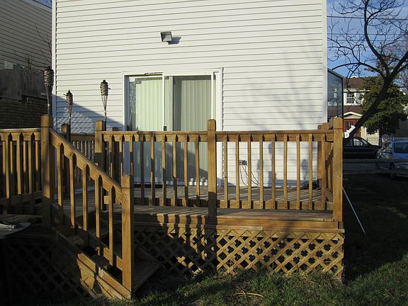 The rear of the home boasts a large deck; perfect for entertaining.