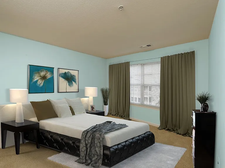 Renovated Package III bedroom with carpeted flooring