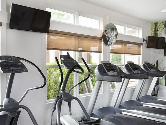 24-hour athletic center with sound system and TVs