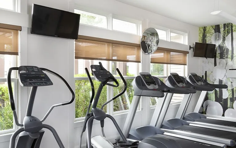 24-hour athletic center with sound system and TVs