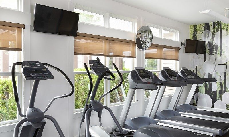 24-hour athletic center with sound system and TVs