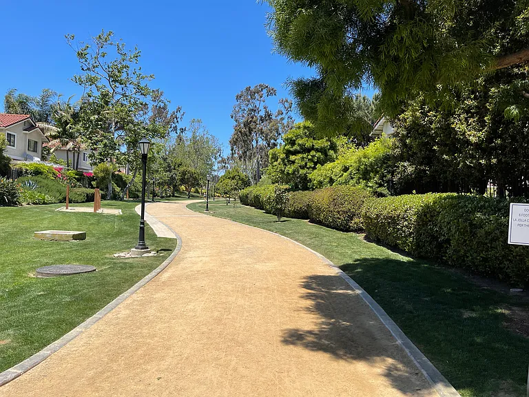 The Greenbelt with par-course stations for jogging and open space park, across the street is shopping center.