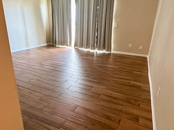 Ascending the stairs from the ground level entrance and carport, you enter a bright open livingroom that seamlessly blends living, dining and kitchen areas.