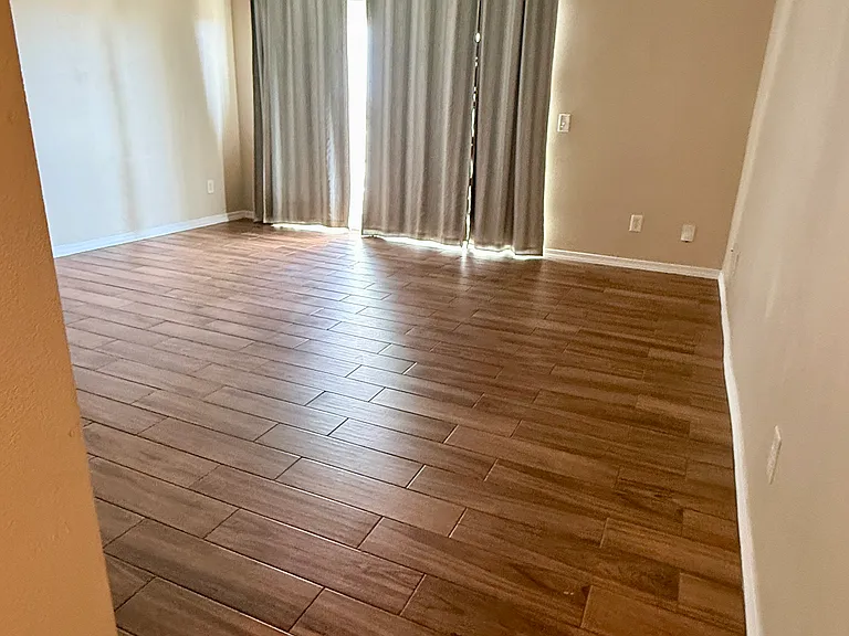 Ascending the stairs from the ground level entrance and carport, you enter a bright open livingroom that seamlessly blends living, dining and kitchen areas.