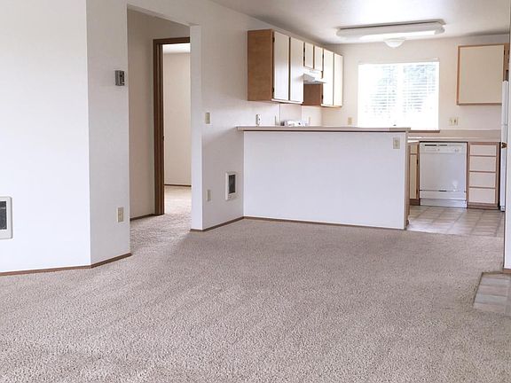 Looking toward kitchen and dining area from large living room. An open plan.