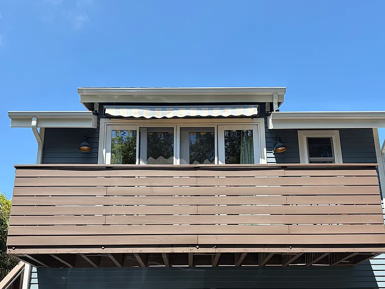 Front of studio (2nd floor above garage) with balcony.