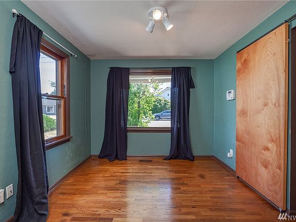 The dining room, featuring hardwood flooring and great access to the kitchen and living room.