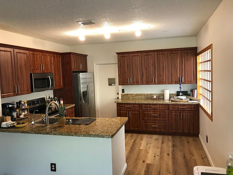 Lots of cabinet space in this updated kitchen with granite countertops.