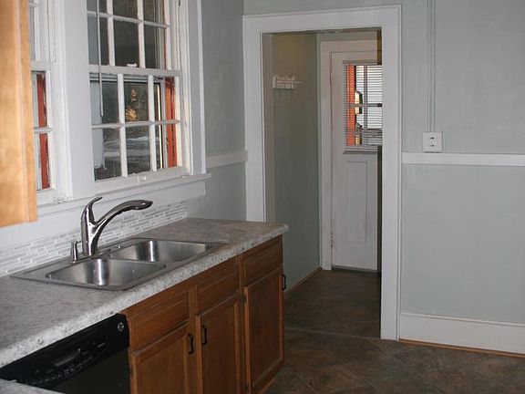 Updated kitchen with stainless appliances and unique 'copper' ceiling
