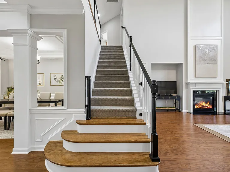A sweeping staircase leads to the upper level, where three generously sized secondary bedrooms and a large bonus room provide exceptional space and flexibility for today's lifestyle