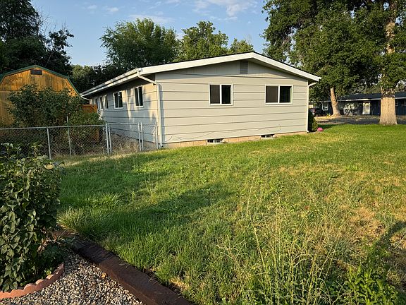 Side view. The windows at the bottom are for basement.