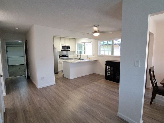 Step into into home from huge 578 sq ft 2 car enclose garage with remote and lots of storage cabinets.