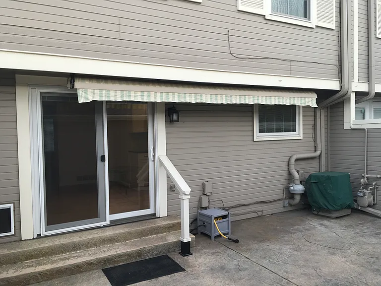 Private back porch with electric awning