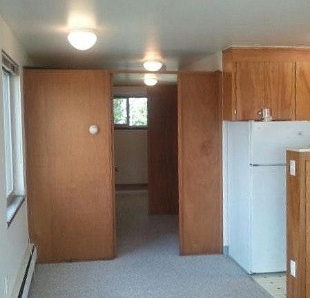 Living room looking into hallway , then into the bedroom wi