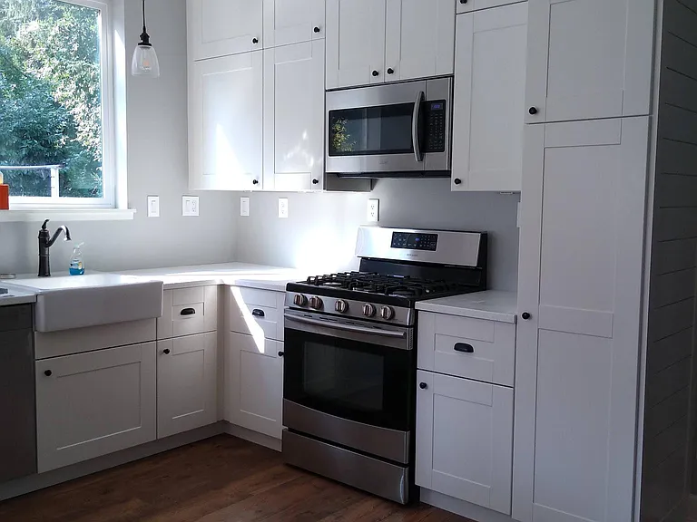 Kitchen - natural gas range , shaker cabinets, farmhouse sink