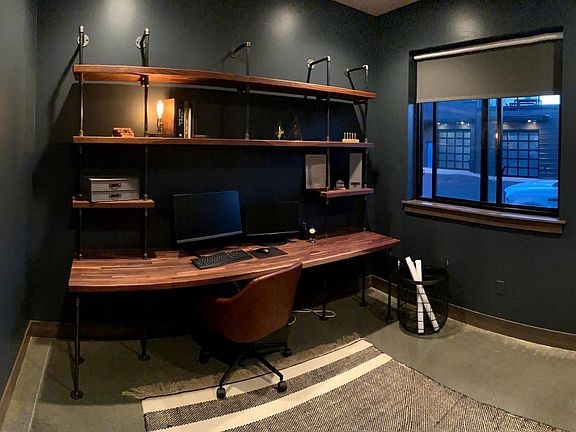 Built in desk, made out of American Walnut (possibility to leave it there if tenants would like to keep this room as an office). We currently have a pull out couch in there so this room can be a guest bedroom as well. Room contains a closet