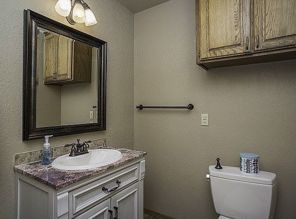 Large half bath with marble countertop