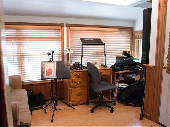 Insulated Sun-Porch/Bedroom with Bamboo floors and natural woodwork (Sample Furnishings for a Music Teacher)