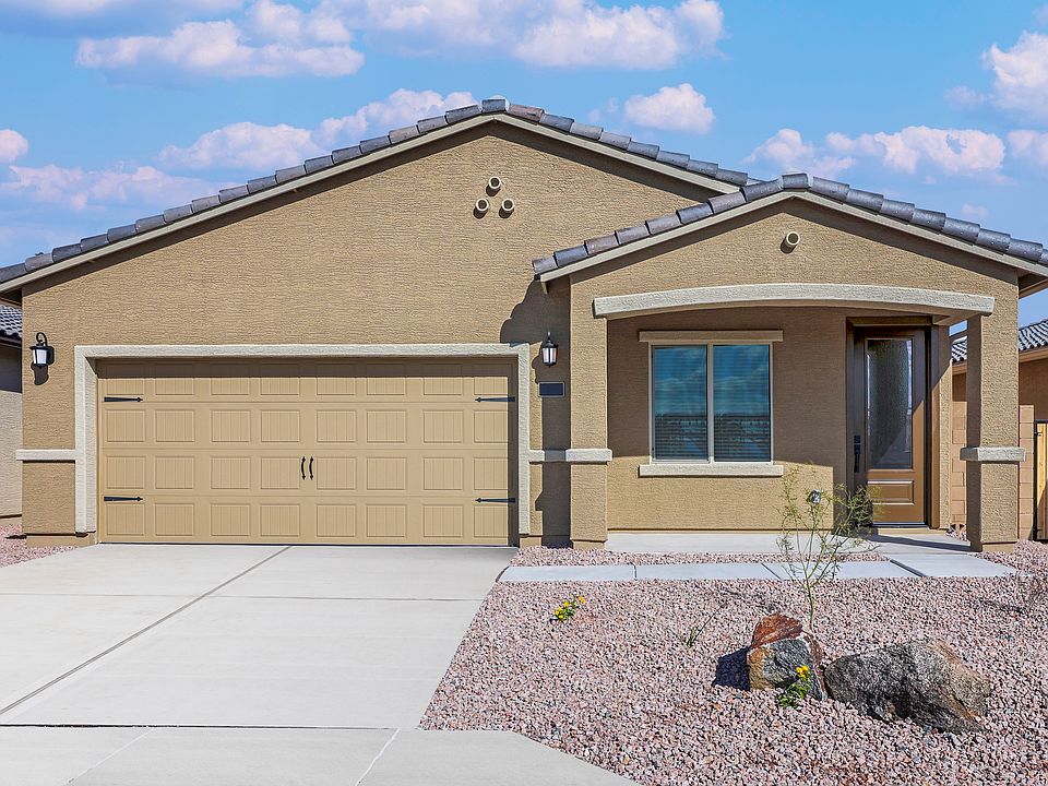 Exterior of the Taos with a covered front porch and two-car garage.