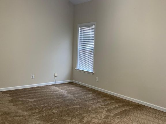 Master bedroom has cathedral ceiling and ceiling fan