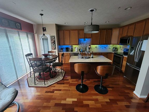 Spacious Kitchen with granite counters stainless steel appliances.