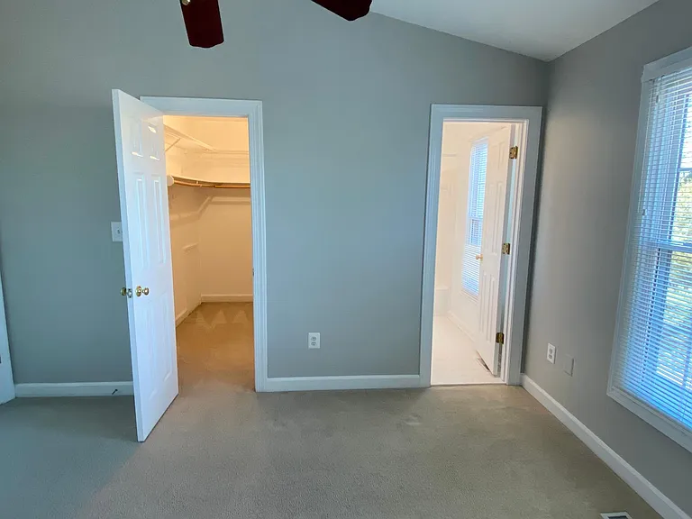 Master bedroom with large walk-in closet and bathroom.